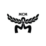 Black mcm logo with laurel wreath design and ribbon motif.