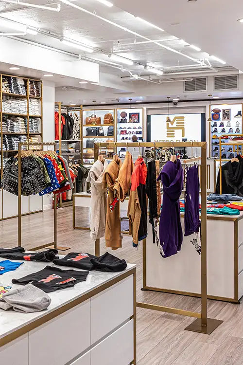 Gold-framed clothing rack with colorful garments