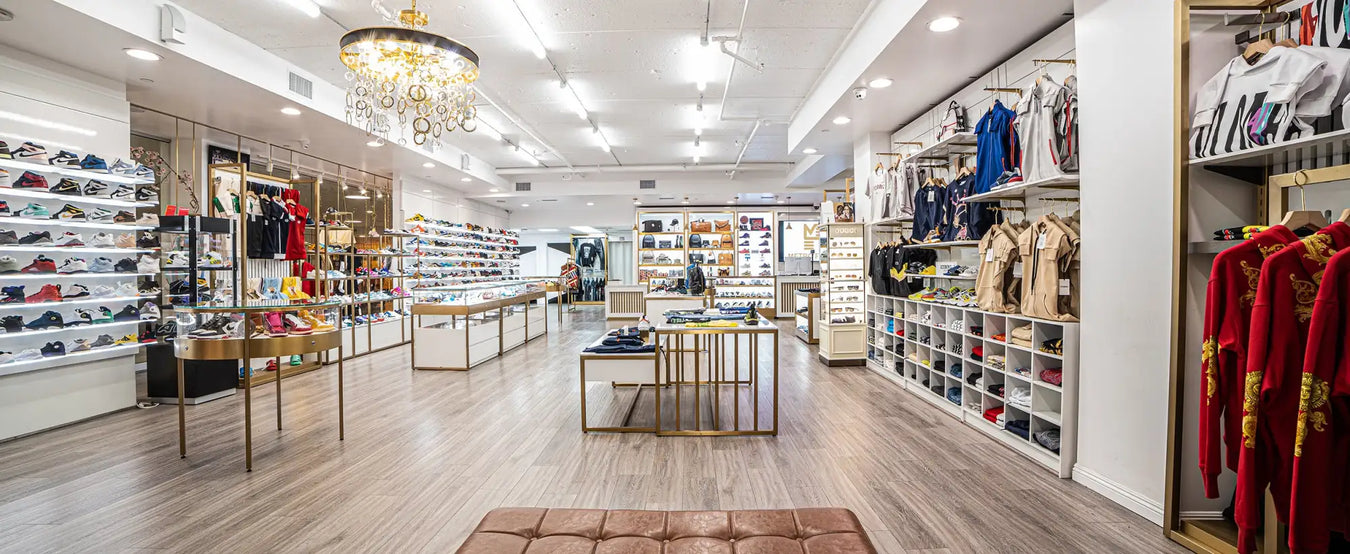 Leather bench with gold accents and tufted upholstery.