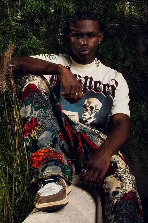Man in skull-themed clothing.