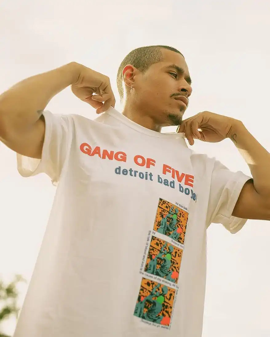 White t-shirt with graphic prints.